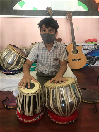 The students of Grade II were given an opportunity to experience the joy of learning in real life situation by their English teacher who integrated their English lesson with their favourite performing art - Music.